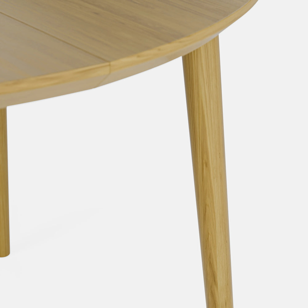 שולחן אוכל עגול נפתח מעץ אלון בעיצוב מודרני חמים