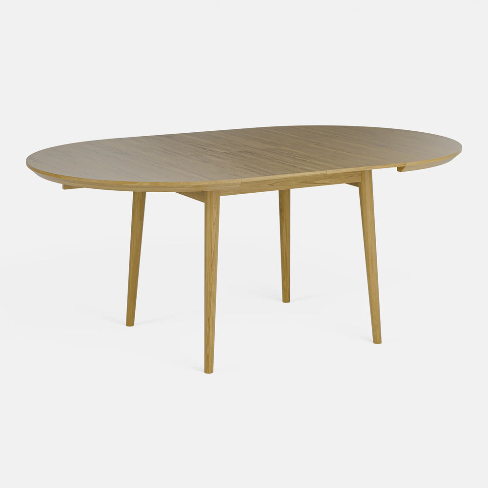 שולחן אוכל עגול נפתח מעץ אלון בעיצוב מודרני חמים