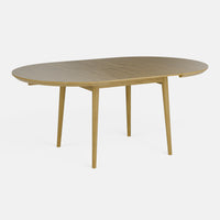 שולחן אוכל עגול נפתח מעץ אלון בעיצוב מודרני חמים
