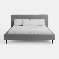 מיטה זוגית מרופדת בבד אריג בעיצוב מודרני נקי